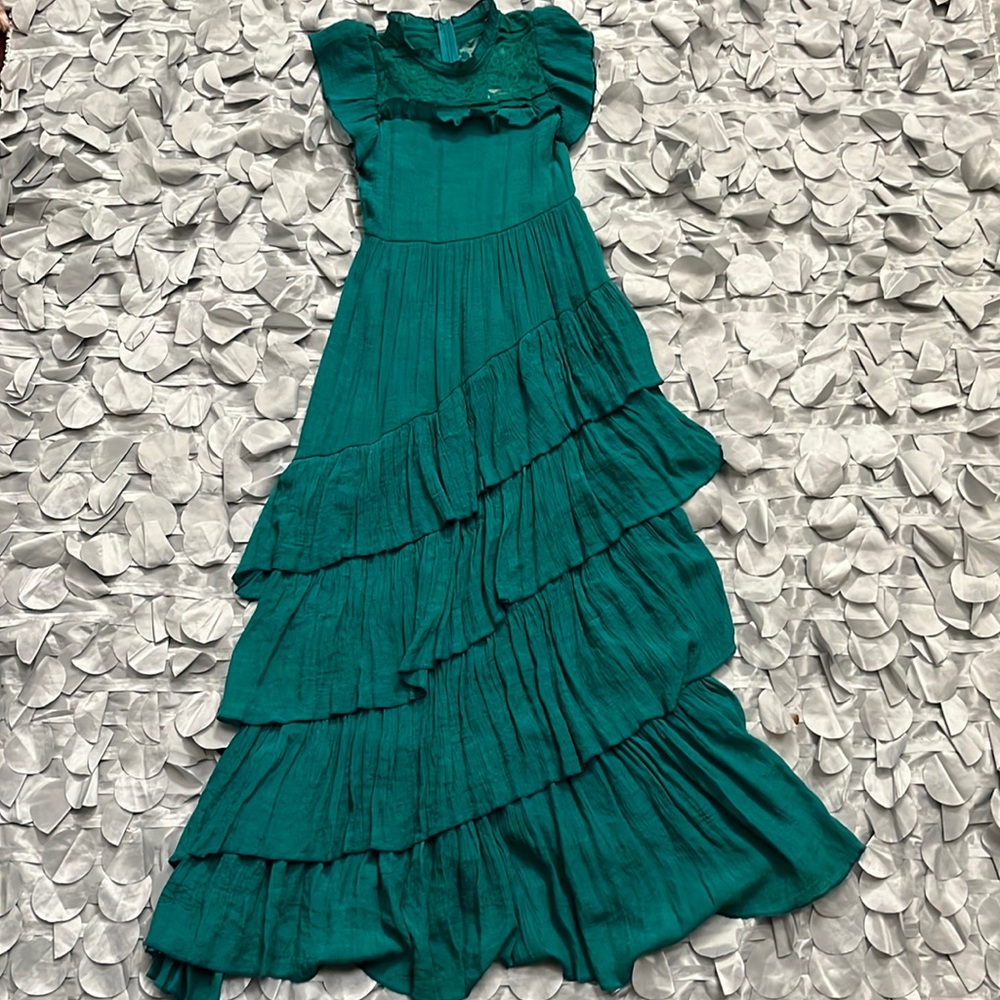A teal green long asymmetrical tiered dress for girls.
